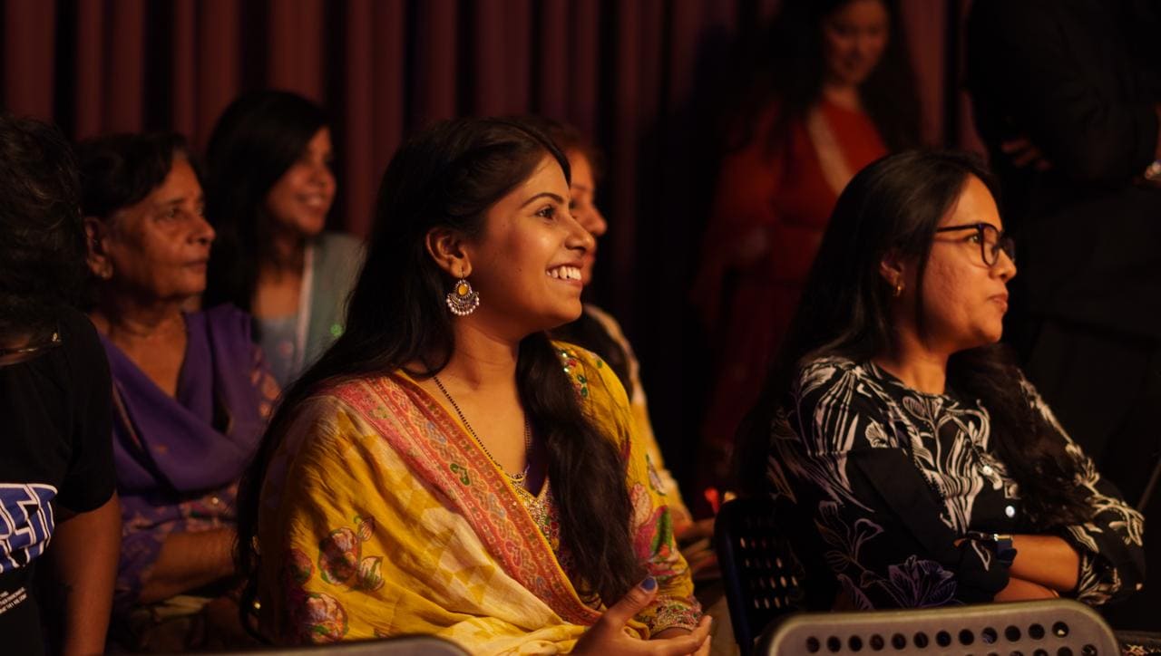 Audience members seated and engaged during a Quissa Ghar performance